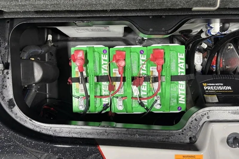 Slide: The Image of Battery compartment of a 2026 Skeeter ZXE20 with Interstate batteries and Minn Kota Precision charger. - 30