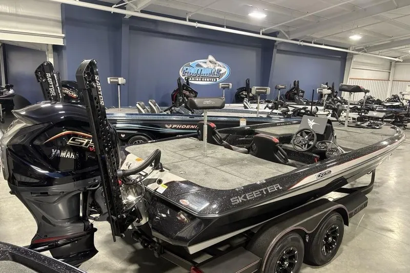 Slide: The Image of 2026 Skeeter ZXE20 boat with Yamaha engine in showroom, featuring sleek design and advanced features. - 5