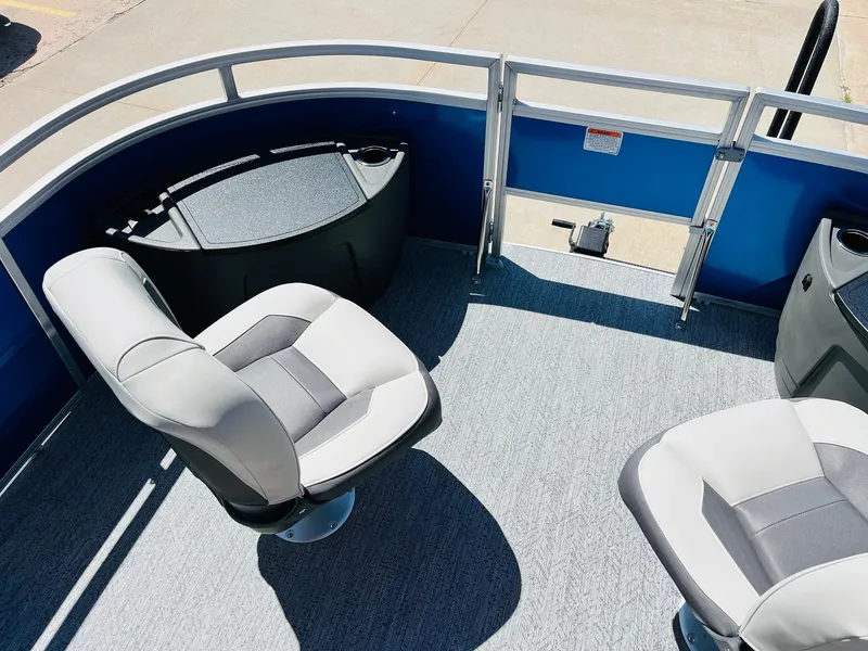 Slide: The Image of 2026 Sun Tracker Fishin' Barge 20 DLX interior with comfortable seating and fishing station. - 12