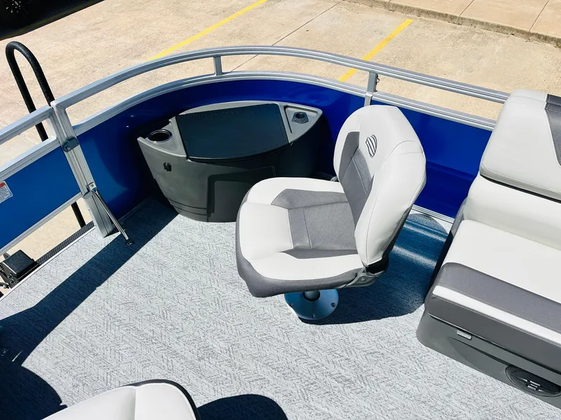 Slide: The Image of 2026 Sun Tracker Fishin' Barge 20 DLX interior with seating and storage. - 16