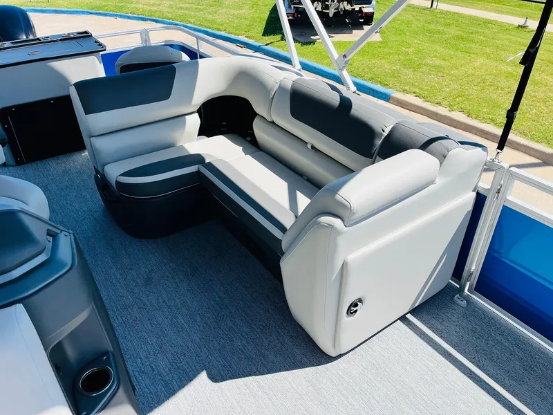Slide: The Image of 2026 Sun Tracker Fishin' Barge 20 DLX interior seating with gray upholstery. - 23