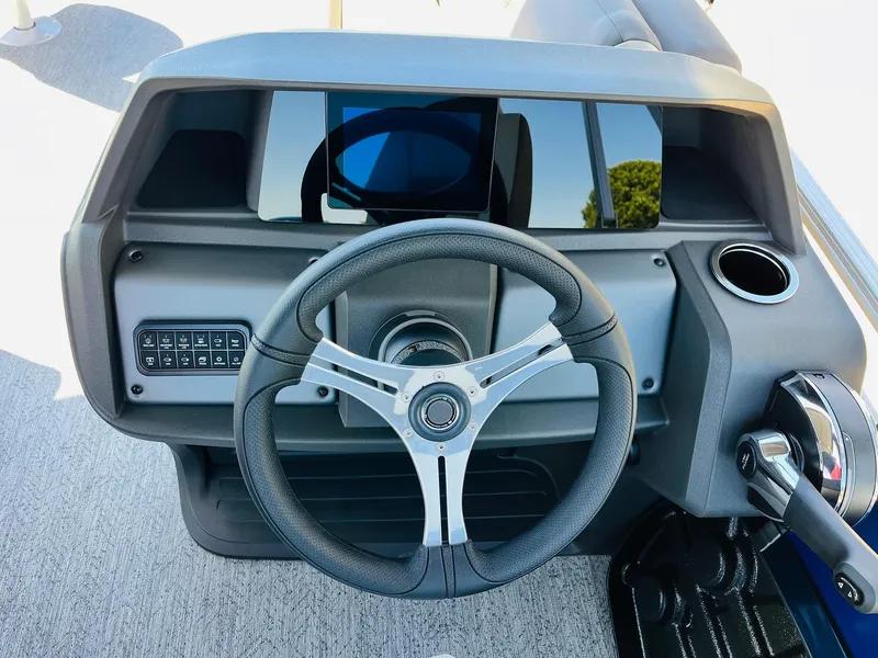 Slide: The Image of 2026 Sun Tracker Fishin' Barge 20 DLX steering console with modern controls and sleek design. - 34