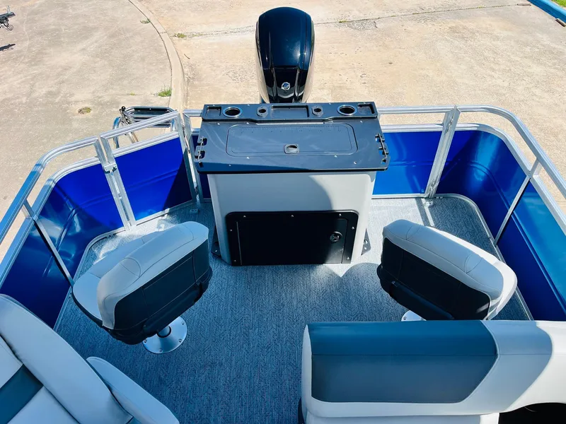 Slide: The Image of 2026 Sun Tracker Fishin' Barge 20 DLX interior with seating and control console. - 35