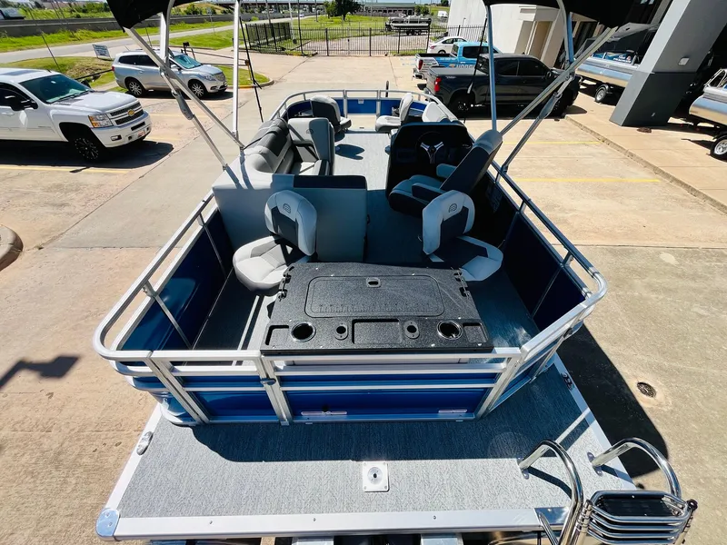 Slide: The Image of 2026 Sun Tracker Fishin' Barge 20 DLX pontoon boat with seating and fishing amenities. - 36