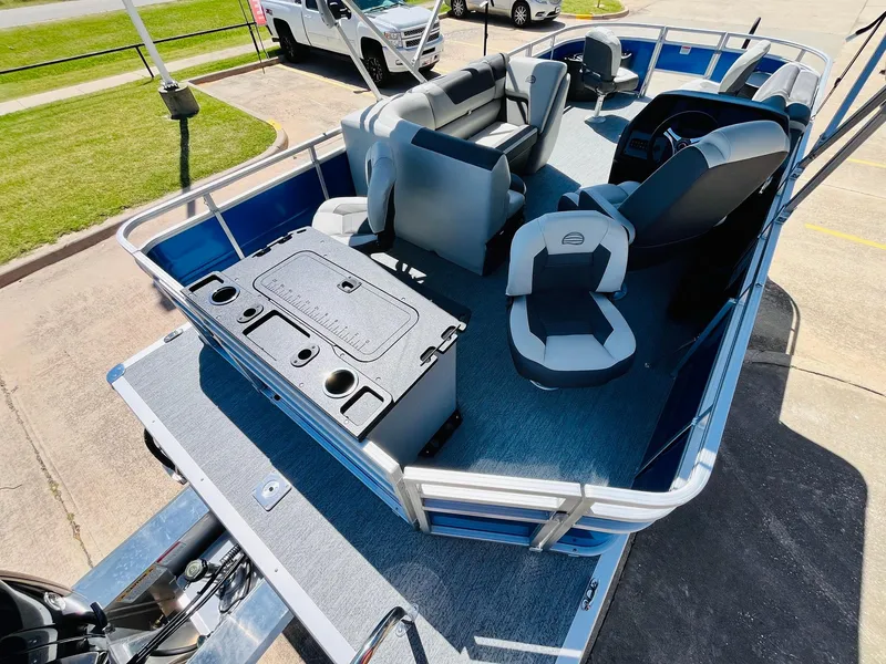 Slide: The Image of 2026 Sun Tracker Fishin' Barge 20 DLX pontoon boat interior with seating and console. - 38