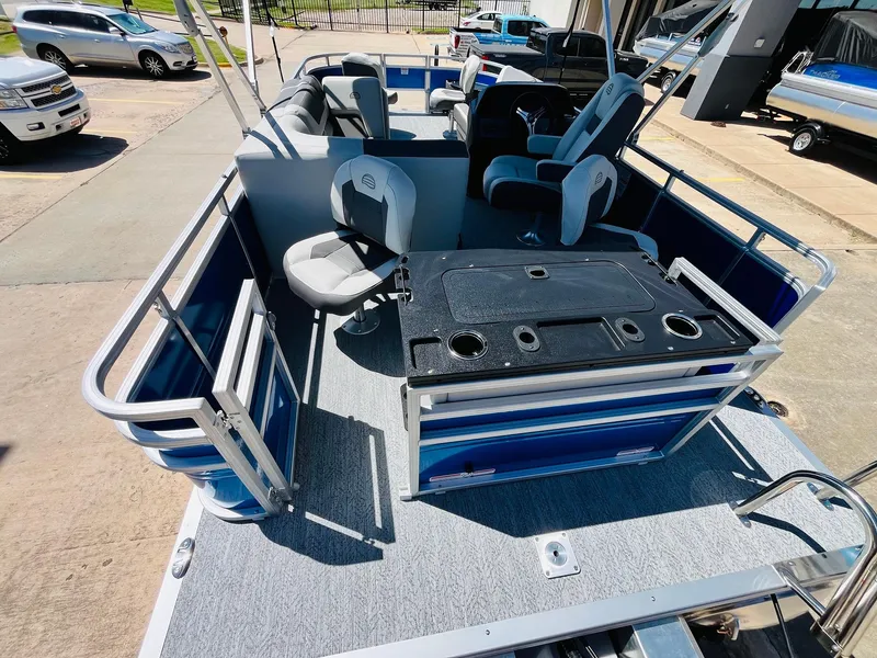 Slide: The Image of 2026 Sun Tracker Fishin' Barge 20 DLX pontoon boat with seating and fishing amenities. - 43