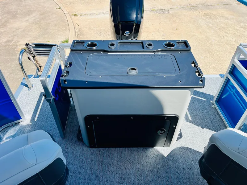 Slide: The Image of 2026 Sun Tracker Fishin' Barge 20 DLX boat interior with fishing station and seating. - 45