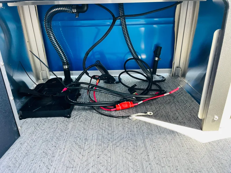 Slide: The Image of 2026 Sun Tracker Fishin' Barge 20 DLX wiring and cables under deck. - 49