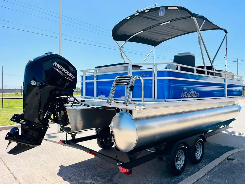 Slide: The Image of 2026 Sun Tracker Fishin' Barge 20 DLX pontoon boat with Mercury engine on trailer. - 6