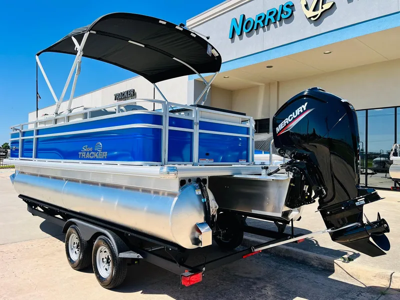 Slide: The Image of 2026 Sun Tracker Fishin' Barge 20 DLX pontoon boat with Mercury engine at dealership. - 8