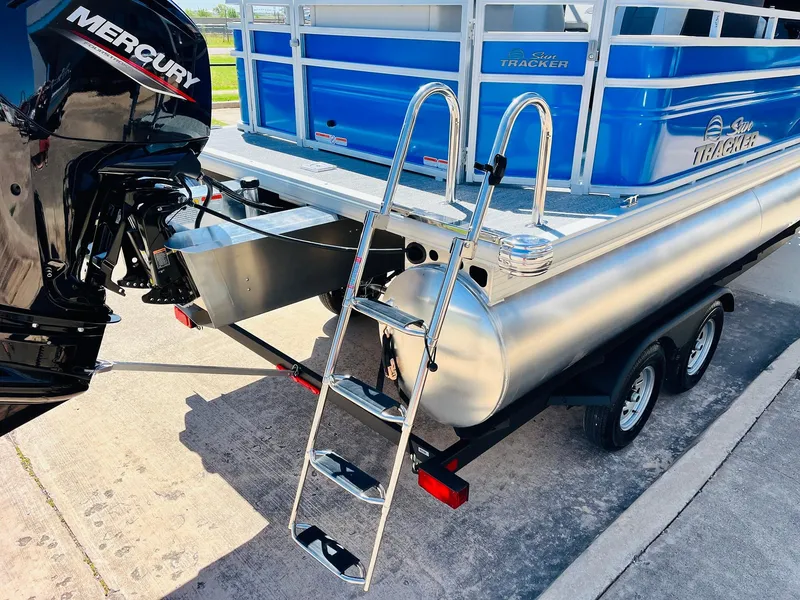 Slide: The Image of 2026 Sun Tracker Fishin' Barge 20 DLX with Mercury engine and trailer ladder. - 9