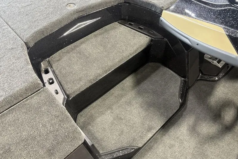 Slide: The Image of Interior view of 2026 Skeeter ZXE20 boat, featuring carpeted steps and sleek design. - 19