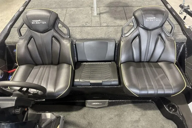 Slide: The Image of 2026 Skeeter ZXE20 boat interior with two black seats and steering wheel. - 21