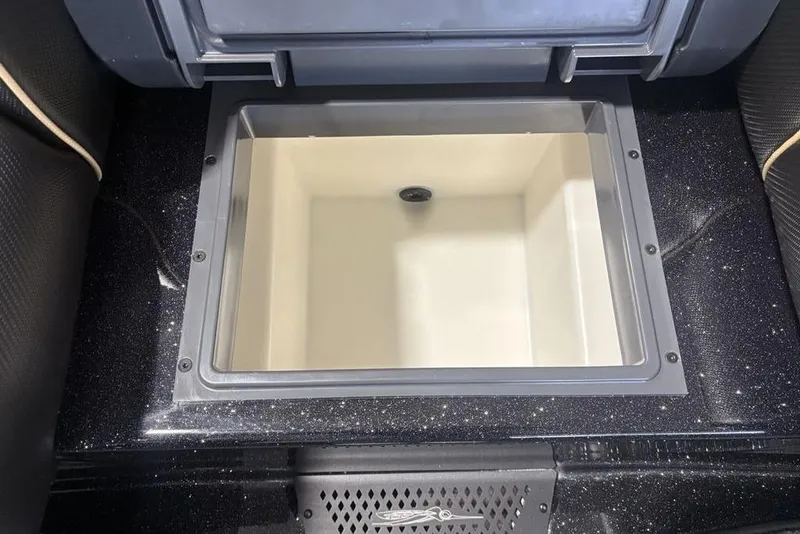 Slide: The Image of 2026 Skeeter ZXE20 boat livewell with sleek black finish and spacious interior. - 24