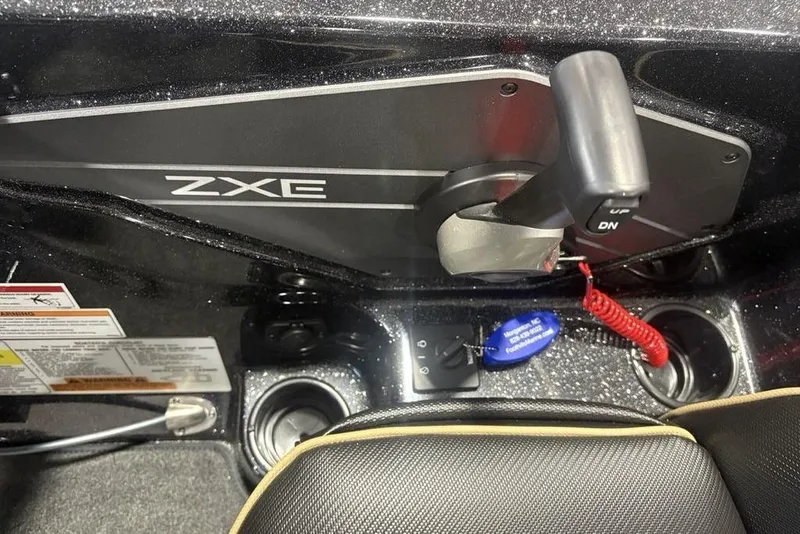 Slide: The Image of Control panel of 2026 Skeeter ZXE20 boat with throttle and safety features. - 25