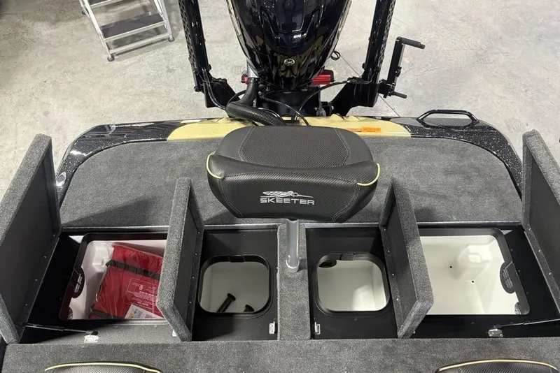Slide: The Image of 2026 Skeeter ZXE20 boat storage compartments with seat and motor visible. - 30