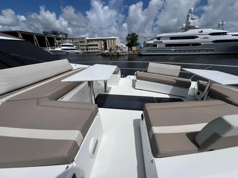 Slide: The Image of Luxurious seating area on 2020 Galeon 680 Fly yacht with scenic marina backdrop. - 11