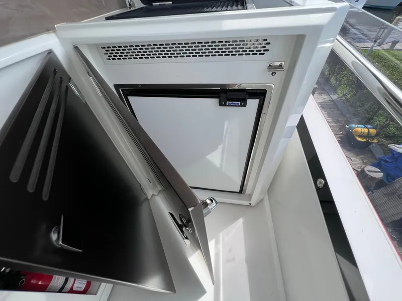 Slide: The Image of Outdoor kitchen on 2020 Galeon 680 Fly yacht with sink and grill, docked at marina. - 19