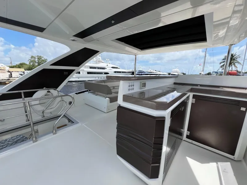 Slide: The Image of Helm of 2020 Galeon 680 Fly yacht with modern controls and plush seating. - 25