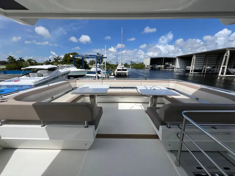 Slide: The Image of Luxurious seating area on 2020 Galeon 680 Fly yacht, docked at marina. - 28