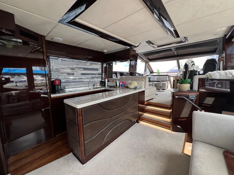Slide: The Image of Luxurious interior of 2020 Galeon 680 Fly yacht with modern kitchen and seating area. - 31