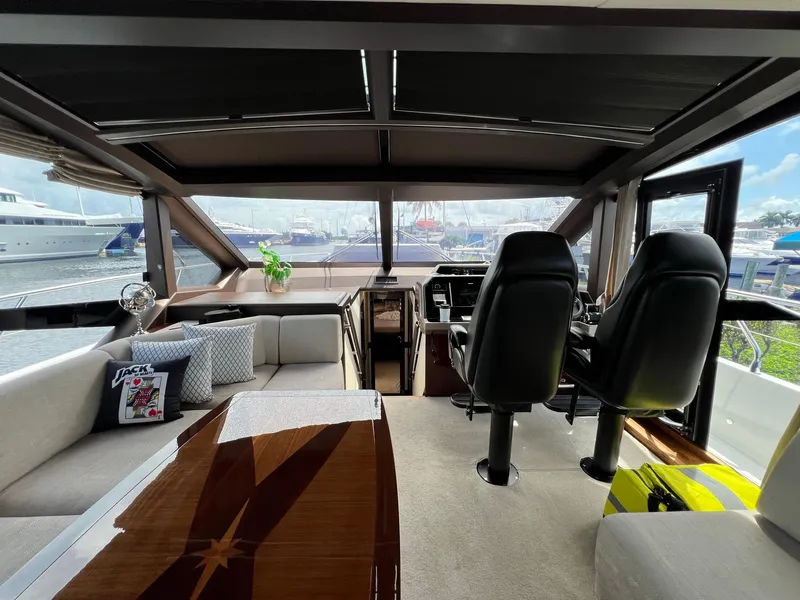 Slide: The Image of Luxurious interior of 2020 Galeon 680 Fly yacht with plush seating and panoramic windows. - 40