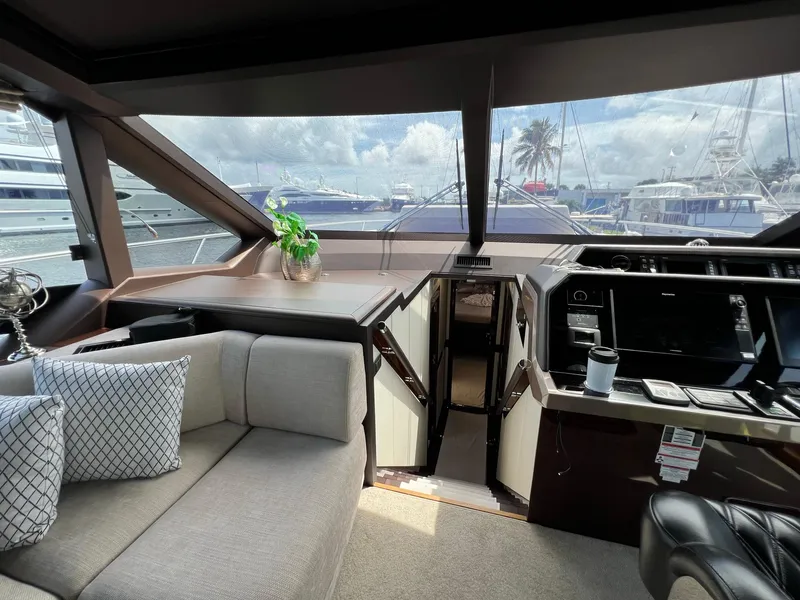 Slide: The Image of Interior helm of 2020 Galeon 680 Fly yacht with modern controls and leather seating. - 42