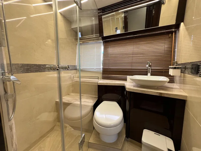 Slide: The Image of Luxurious cabin interior of 2020 Galeon 680 Fly yacht with twin beds and window view. - 46