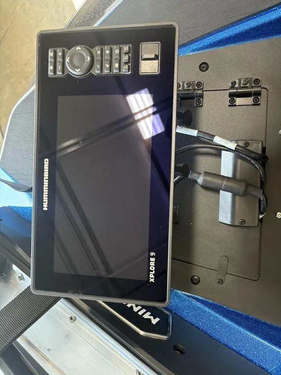 Slide: The Image of Humminbird XPLORE 9 fish finder on 2026 Skeeter ZXE20 boat dashboard. - 10