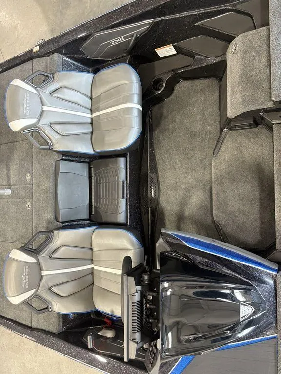 Slide: The Image of 2026 Skeeter ZXE20 boat interior with dual seats and modern dashboard. - 11