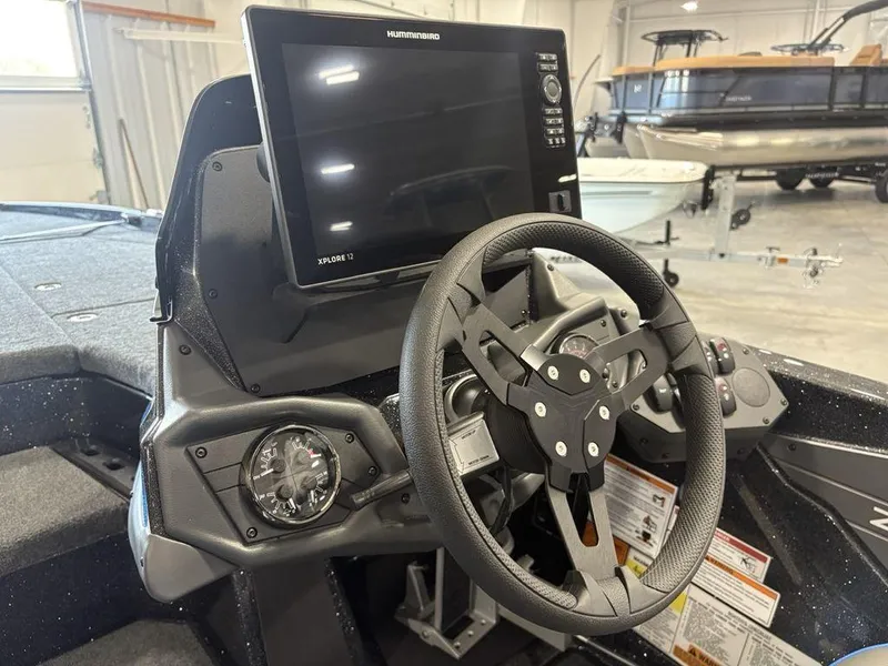 Slide: The Image of Steering console of 2026 Skeeter ZXE20 boat with advanced navigation display. - 12