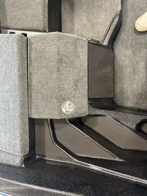 Slide: The Image of Interior view of 2026 Skeeter ZXE20 boat with carpeted flooring and storage compartment. - 15