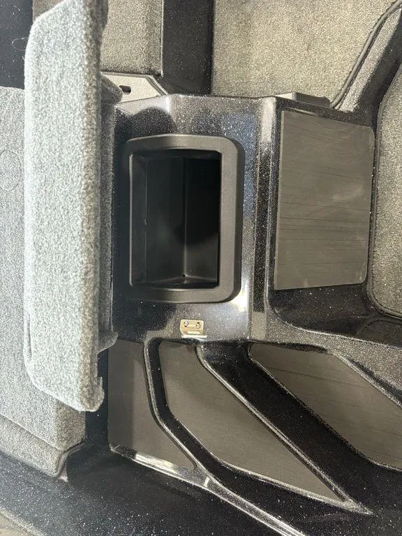 Slide: The Image of Open storage compartment in 2026 Skeeter ZXE20 boat interior. - 17