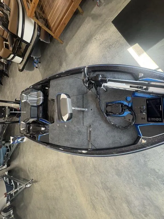 Slide: The Image of 2026 Skeeter ZXE20 fishing boat interior with seating and control panel. - 20