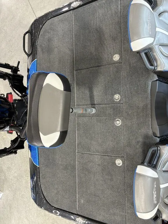 Slide: The Image of 2026 Skeeter ZXE20 boat interior with gray seating and carpeted deck. - 21