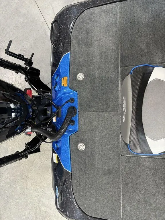 Slide: The Image of 2026 Skeeter ZXE20 boat interior with blue accents and seating. - 22