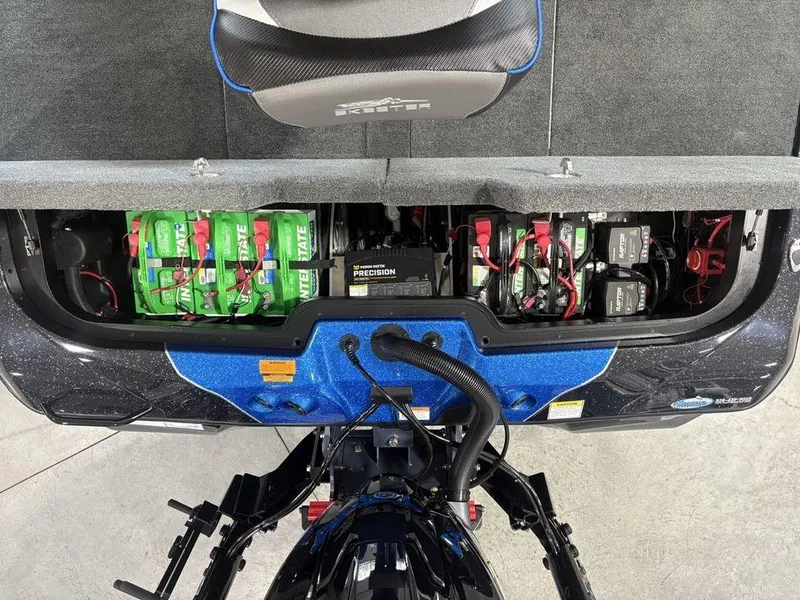 Slide: The Image of 2026 Skeeter ZXE20 boat battery compartment with Interstate batteries and precision charger. - 23