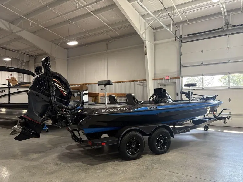 Slide: The Image of 2026 Skeeter ZXE20 boat in showroom, featuring sleek design and powerful engine. - 6