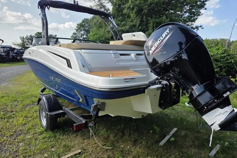 Slide: The Image of 2025 Bayliner VR5 OB boat with Mercury outboard motor on a trailer. - 3
