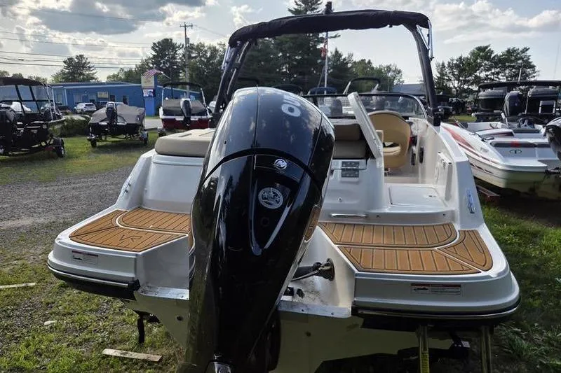 Slide: The Image of 2025 Bayliner VR5 OB boat with outboard motor, displayed outdoors. - 5