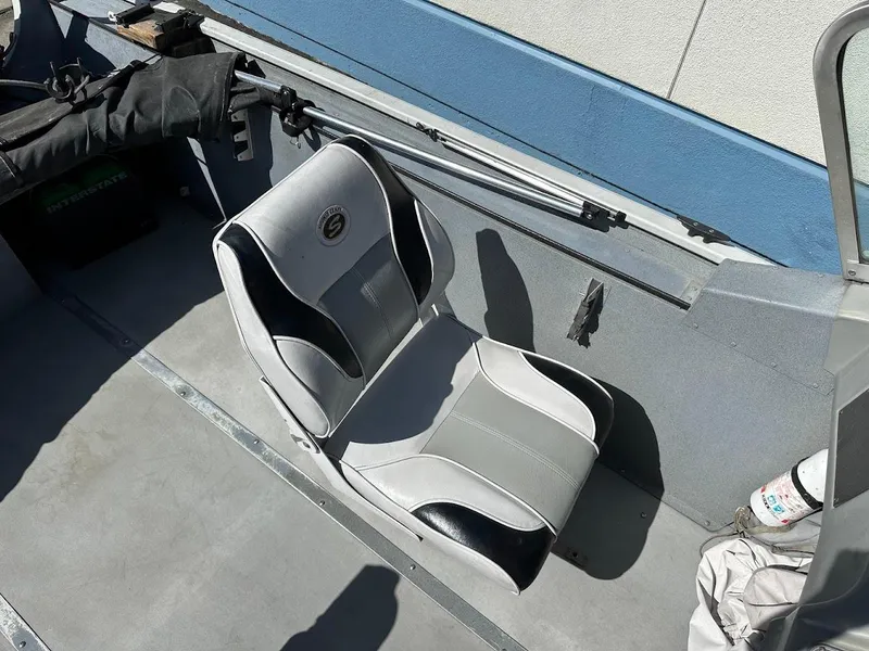 Slide: The Image of 2001 Smoker Craft 160 SP boat interior with gray and black seating. - 13