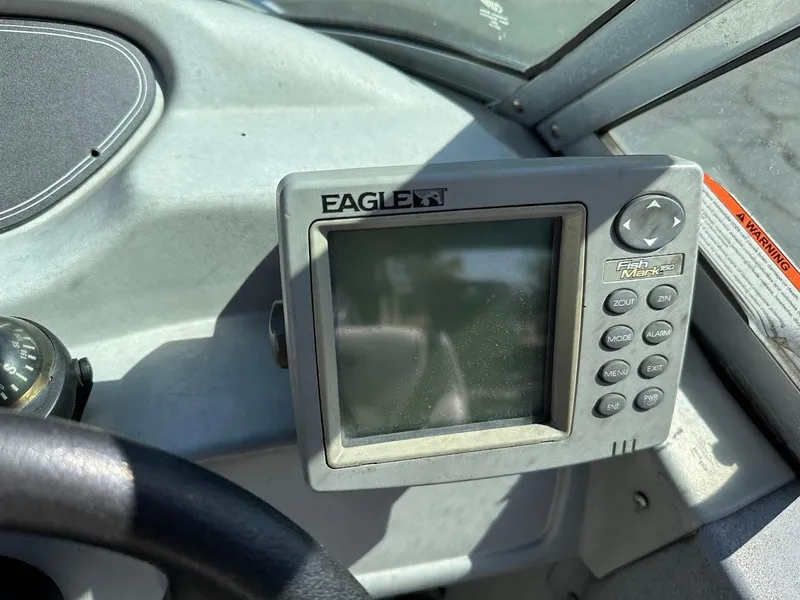 Slide: The Image of Fish finder on 2001 Smoker Craft 160 SP boat dashboard, featuring Eagle FishMark 160 display. - 17
