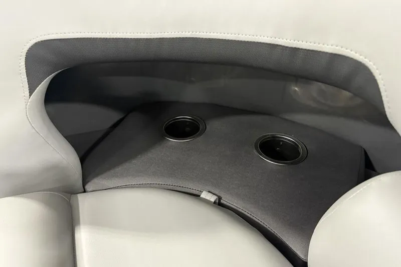 Slide: The Image of 2026 Sun Tracker SportFish™ 22 DLX boat interior with dual cup holders. - 26