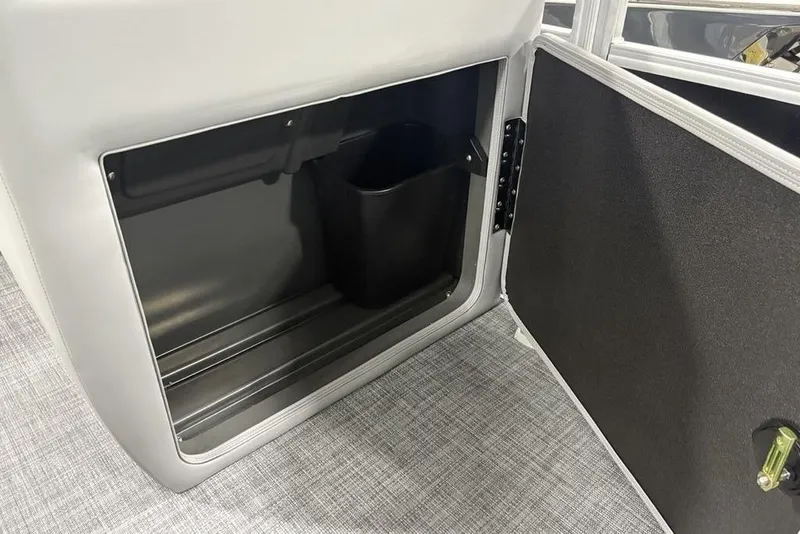 Slide: The Image of Open storage compartment in 2026 Sun Tracker SportFish™ 22 DLX boat interior. - 3