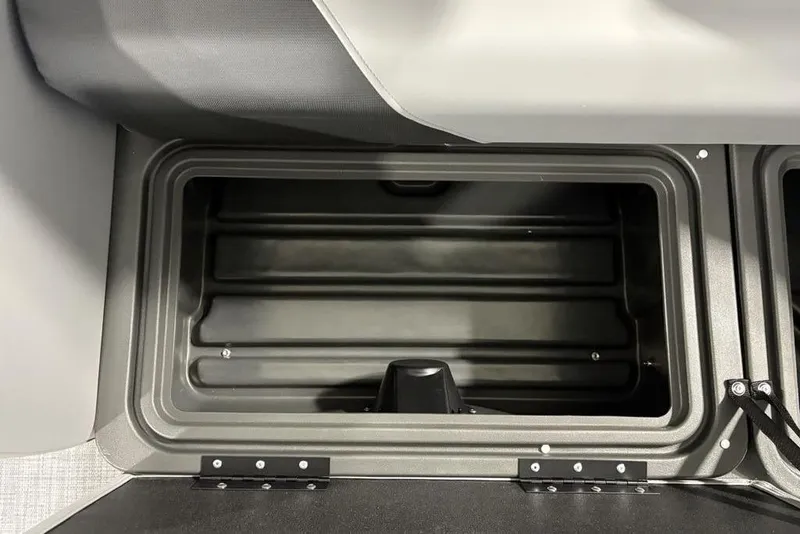 Slide: The Image of 2026 Sun Tracker SportFish™ 22 DLX storage compartment, featuring durable construction and ample space. - 32