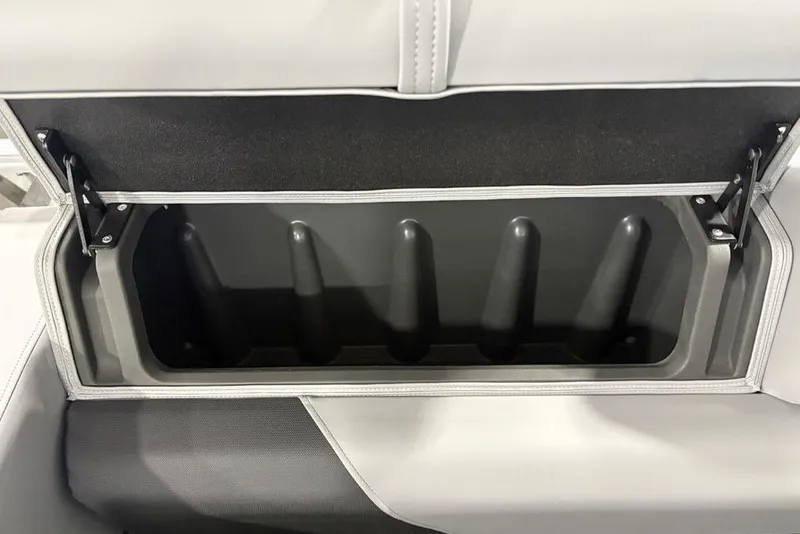 Slide: The Image of 2026 Sun Tracker SportFish™ 22 DLX storage compartment with open lid, showcasing interior space. - 35