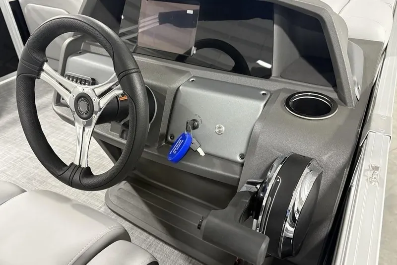 Slide: The Image of 2026 Sun Tracker SportFish™ 22 DLX dashboard with steering wheel and control panel. - 41