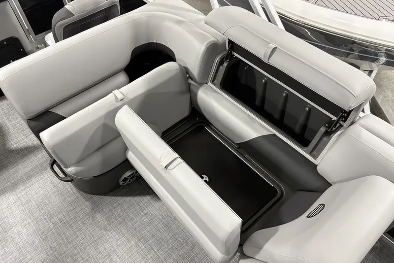 Slide: The Image of 2026 Sun Tracker SportFish™ 22 DLX boat interior with open storage compartments. - 7