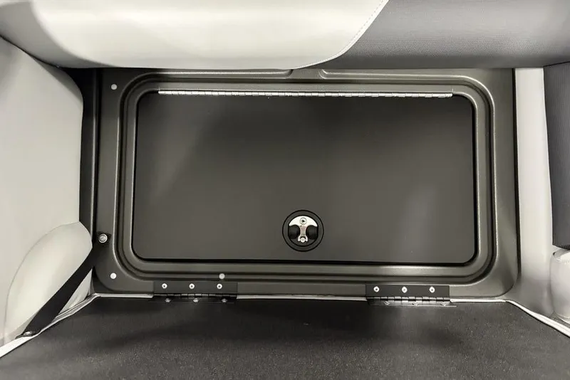 Slide: The Image of 2026 Sun Tracker SportFish™ 22 DLX storage compartment with secure latch. - 9