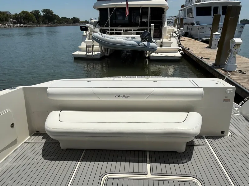 Slide: The Image of 2007 Sea Ray 52 Sedan Bridge yacht with rear seating at dock. - 10